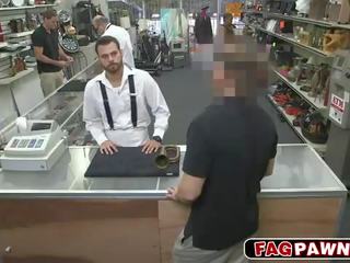 Dude blows a johnson behind counter in a shop