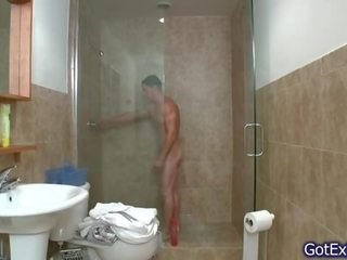 Exceptional muscled boy jerking under shower